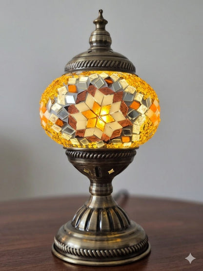 the The Golden Star Turkish Mosaic Lamp on a table